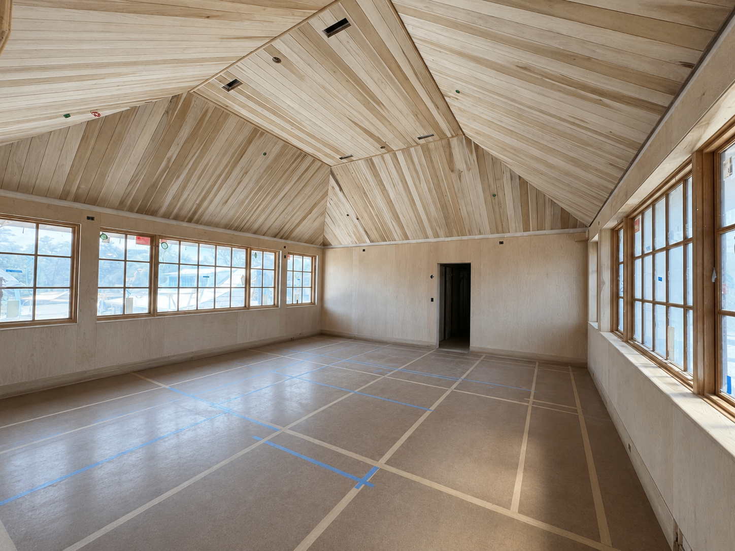 Screened pavilion with stained louvered transom band and wood screen-frame panels